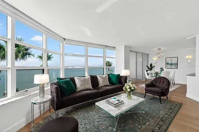a kitchen with stainless steel appliances a refrigerator sink and white cabinets