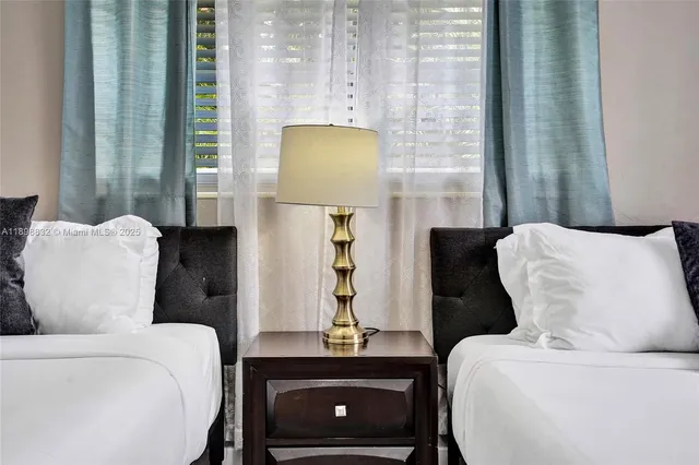 a kitchen with stainless steel appliances a refrigerator sink and microwave