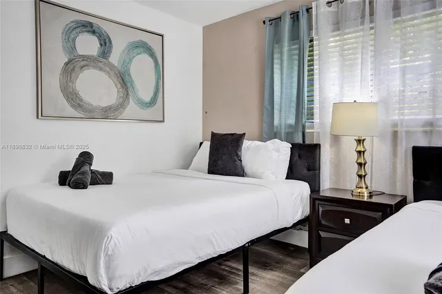 a kitchen with stainless steel appliances granite countertop a sink a stove and a wooden cabinets