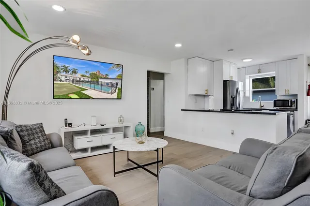a bathroom with a toilet sink and shower