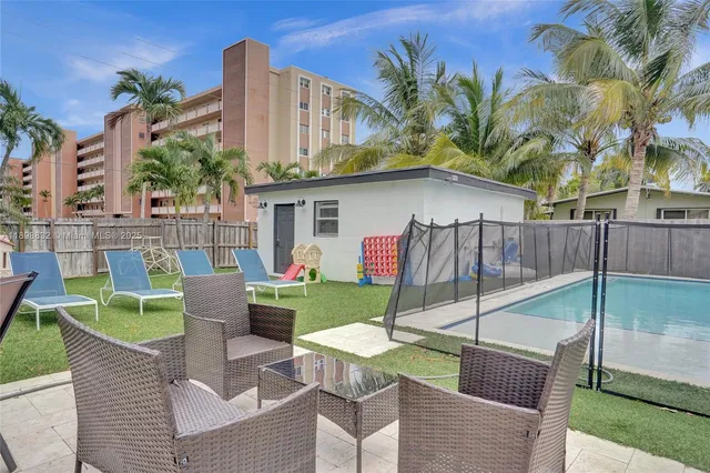 a view of a backyard with a patio