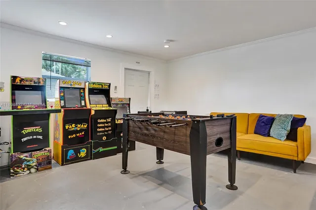 a view of a backyard with couches potted plants and wooden fence