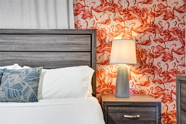 a bedroom with a bed and a cabinet