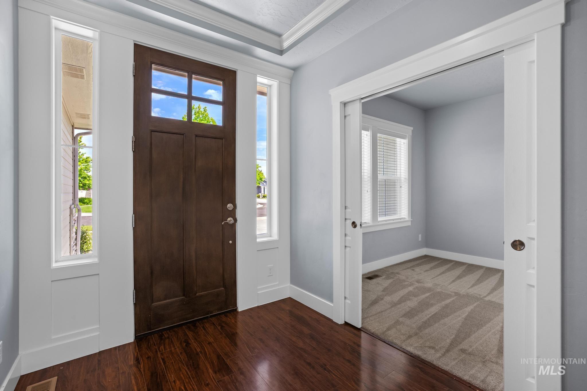 2681 East Rhyolite Court Nampa, ID 83686 - Photo 6 of 48 Entryway featuring a rich wood-finish door with glass inserts and sidelight windows
