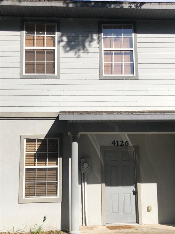 4126 Southwest 15 Place Gainesville, FL 32607 - Photo 1 of 1 a front view of a house with windows