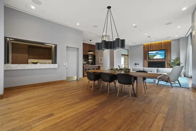a kitchen with kitchen island wooden cabinets and sink
