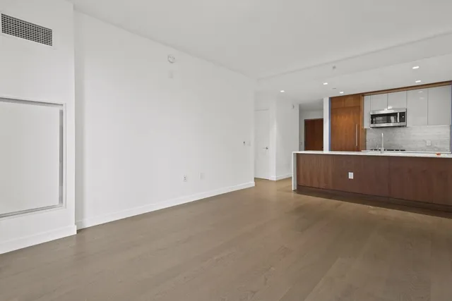 a view of a livingroom and a kitchen