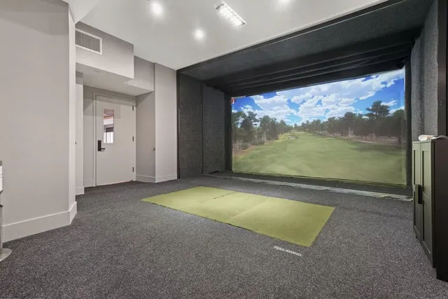 a lobby with furniture and floor to ceiling window