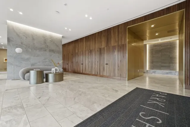 a lobby with furniture and window