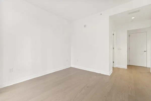 a living room with furniture and a large mirror
