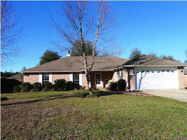 4890 Timber Ridge Drive Pace, FL 32571 - Photo 1 of 18 a front view of a house with a yard