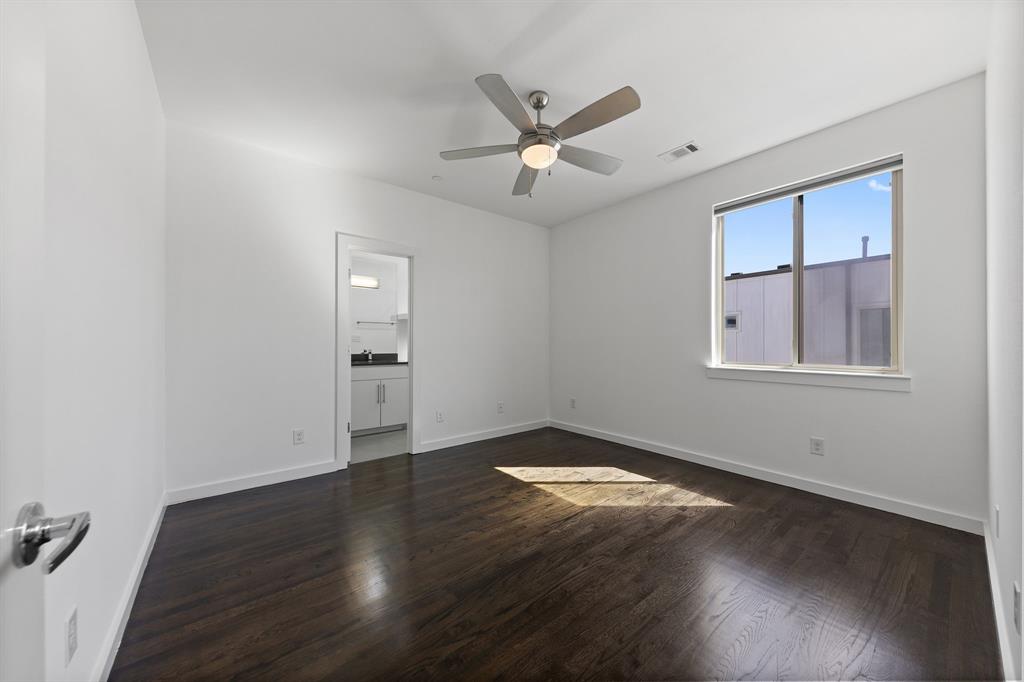 1915 Summit Avenue, Unit 2 Dallas, TX 75206 - Photo 21 of 39 a view of an empty room with wooden floor and a window
