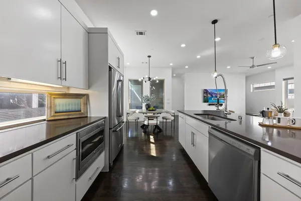 a large kitchen with lots of counter space and appliances