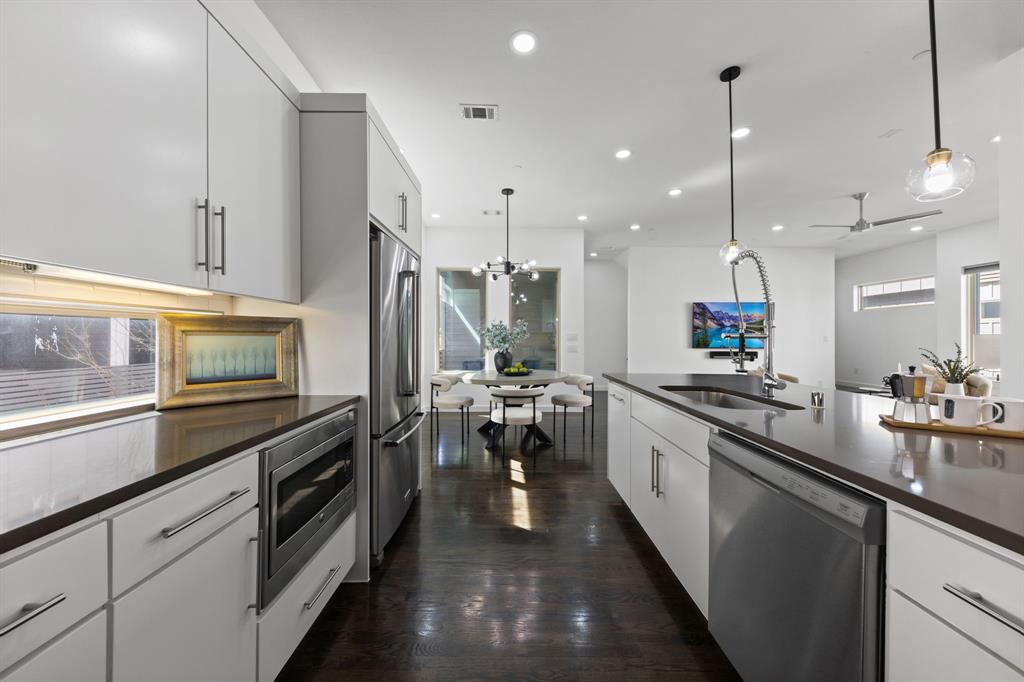 1915 Summit Avenue, Unit 2 Dallas, TX 75206 - Photo 4 of 39 a large kitchen with lots of counter space and appliances