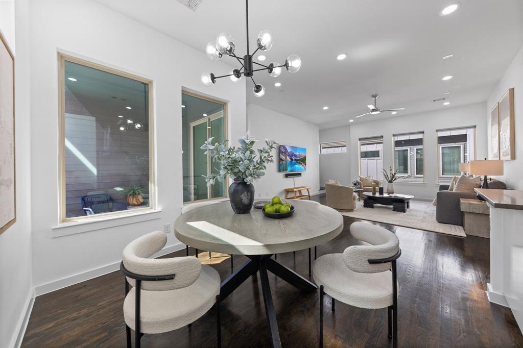 1915 Summit Avenue, Unit 2 Dallas, TX 75206 - Photo 9 of 39 a view of a dining room with furniture wooden floor and chandelier