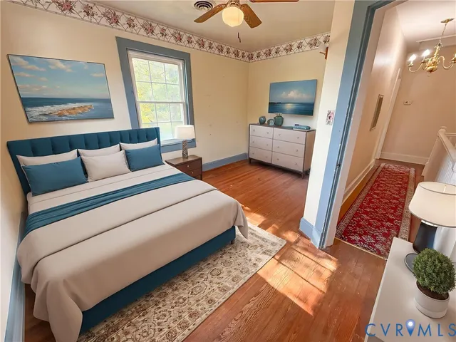 a bedroom with furniture and a large mirror