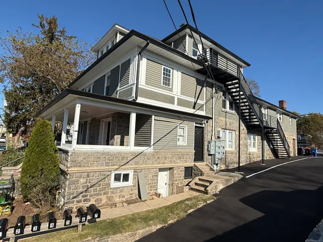 a front view of a house with a ocean view