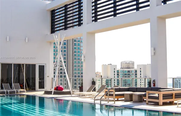 a view of swimming pool with chairs