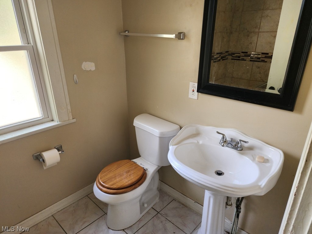 3602 Silsby Road University Heights, OH 44118 - Photo 7 of 19 Bathroom featuring sink, tile floors, and toilet