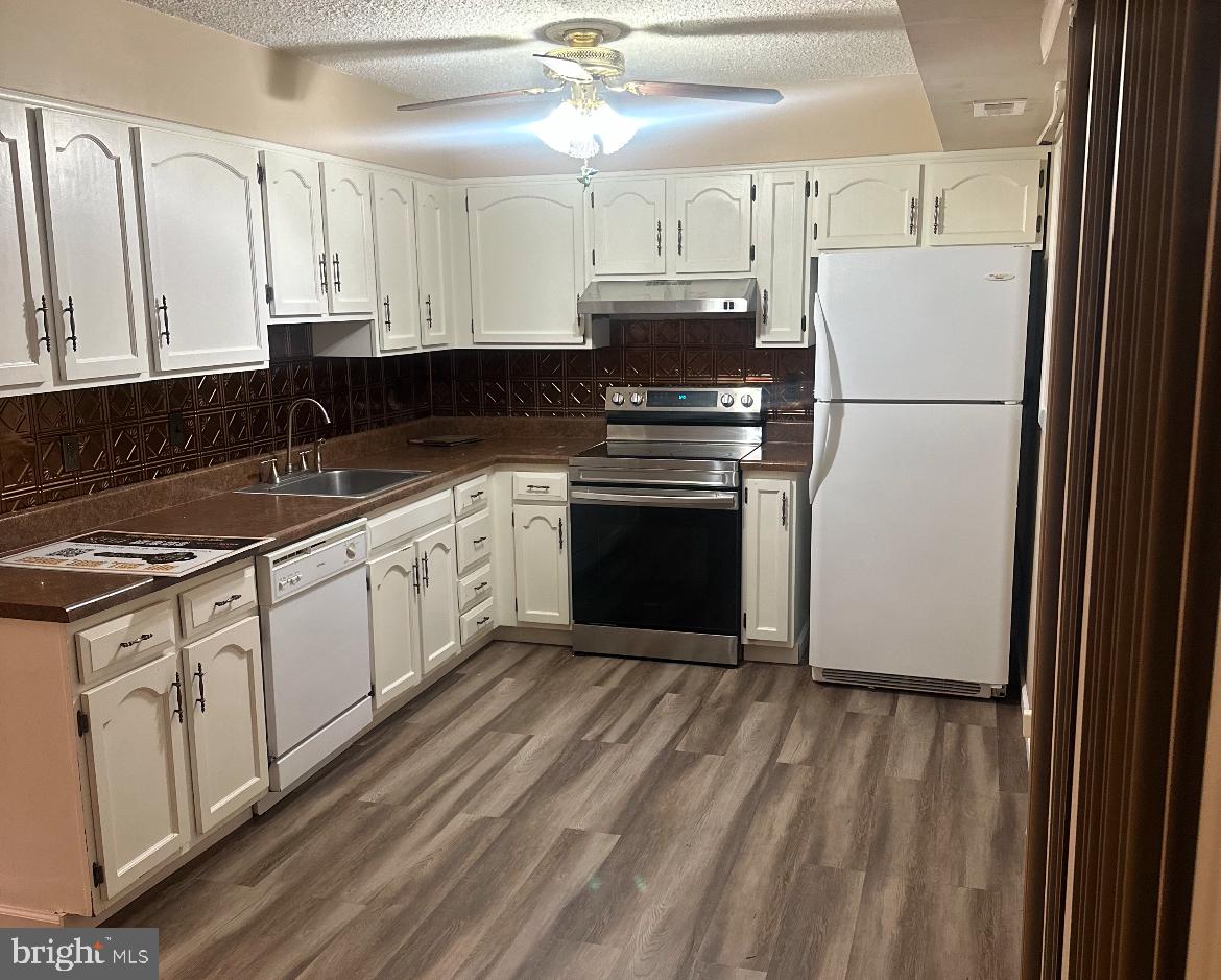 46 Georgetown Road Lindenwold, NJ 08021 - Photo 3 of 10 a kitchen with stainless steel appliances granite countertop a refrigerator sink and stove