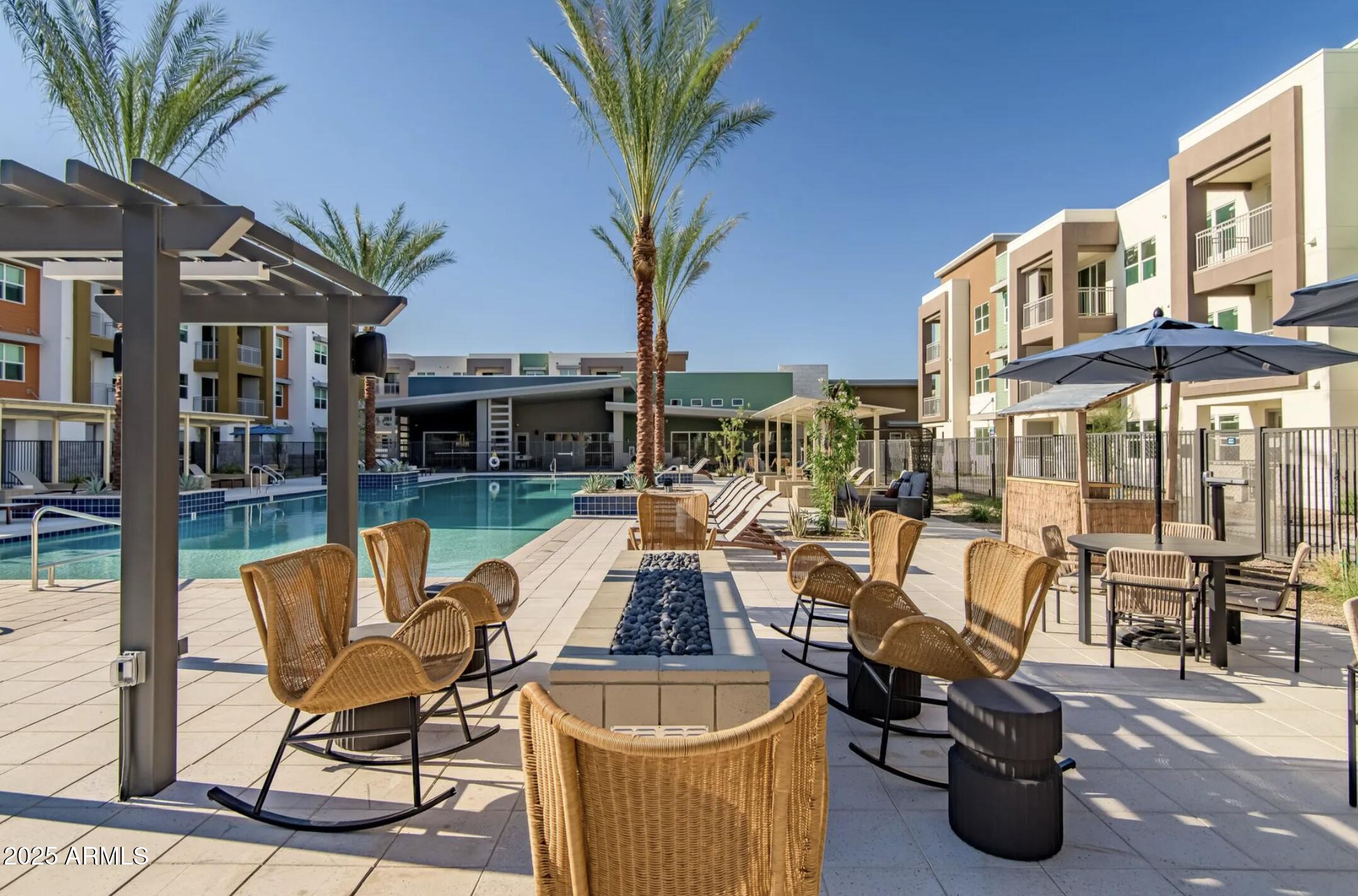 17445 West Lower Buckeye Road, Unit A1 Goodyear, AZ 85338 - Photo 3 of 35 Outdoor pool seating