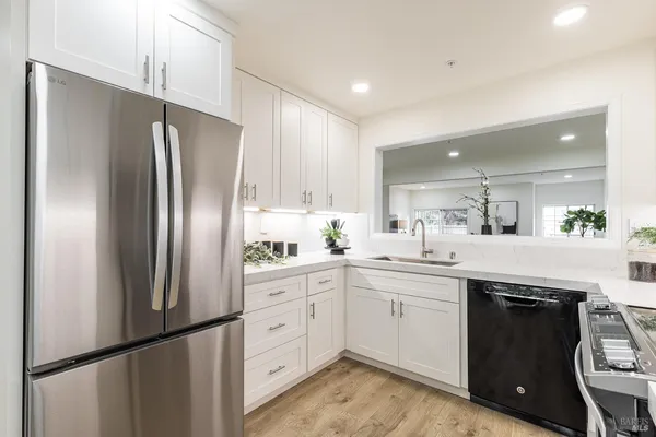 a kitchen with a table and refrigerator