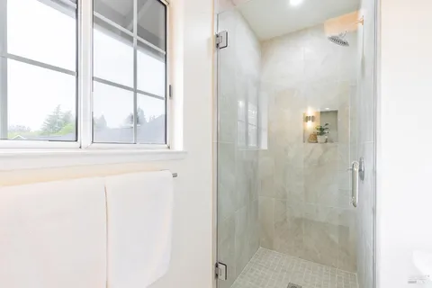 a bathroom with a sink vanity and a mirror
