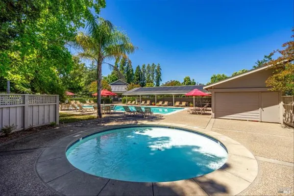 a view of a swimming pool with a patio