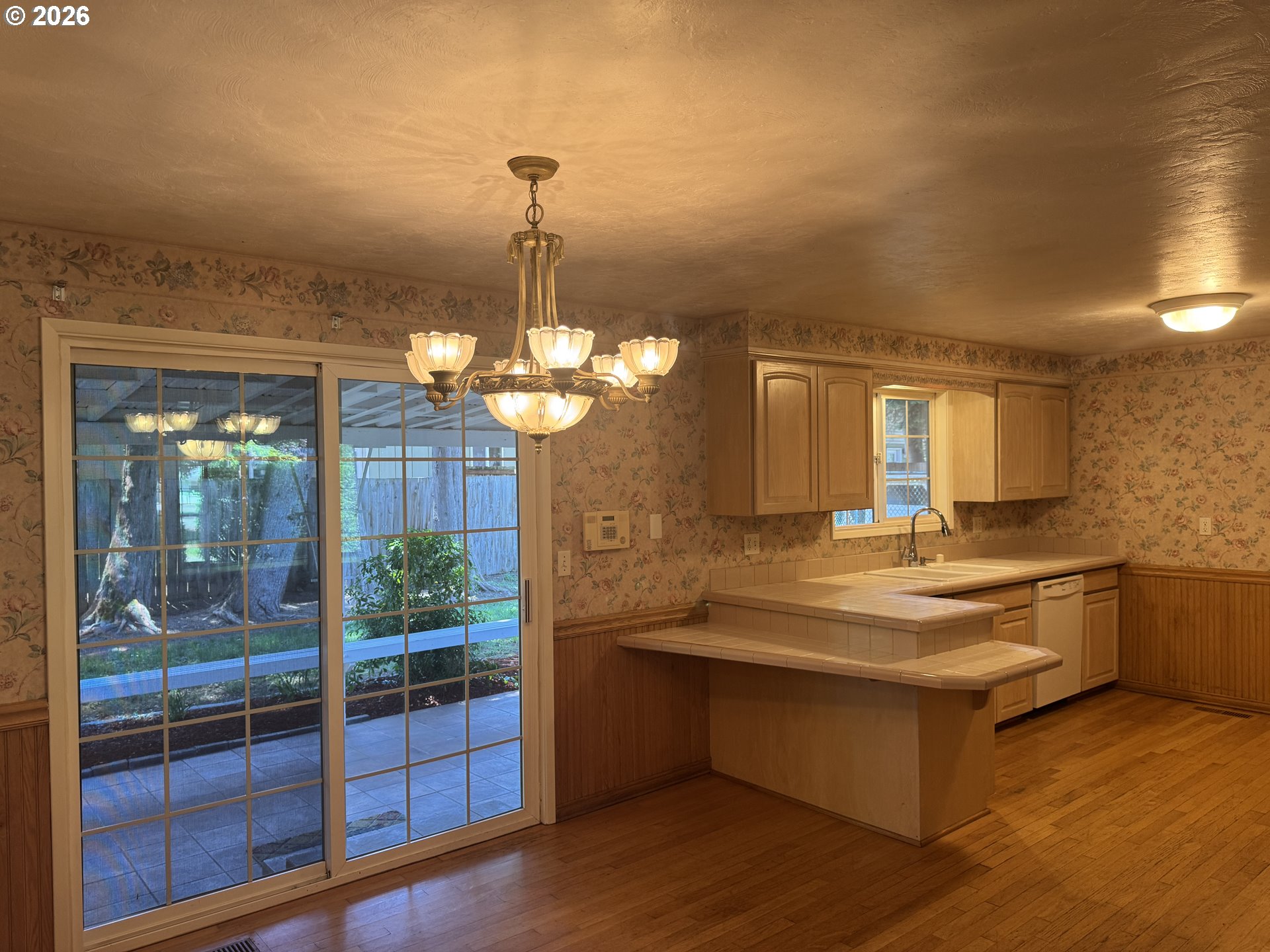 260 Susan Street Eugene, OR 97404 - Photo 8 of 33 a view of a kitchen with granite countertop stainless steel appliances and a chandelier