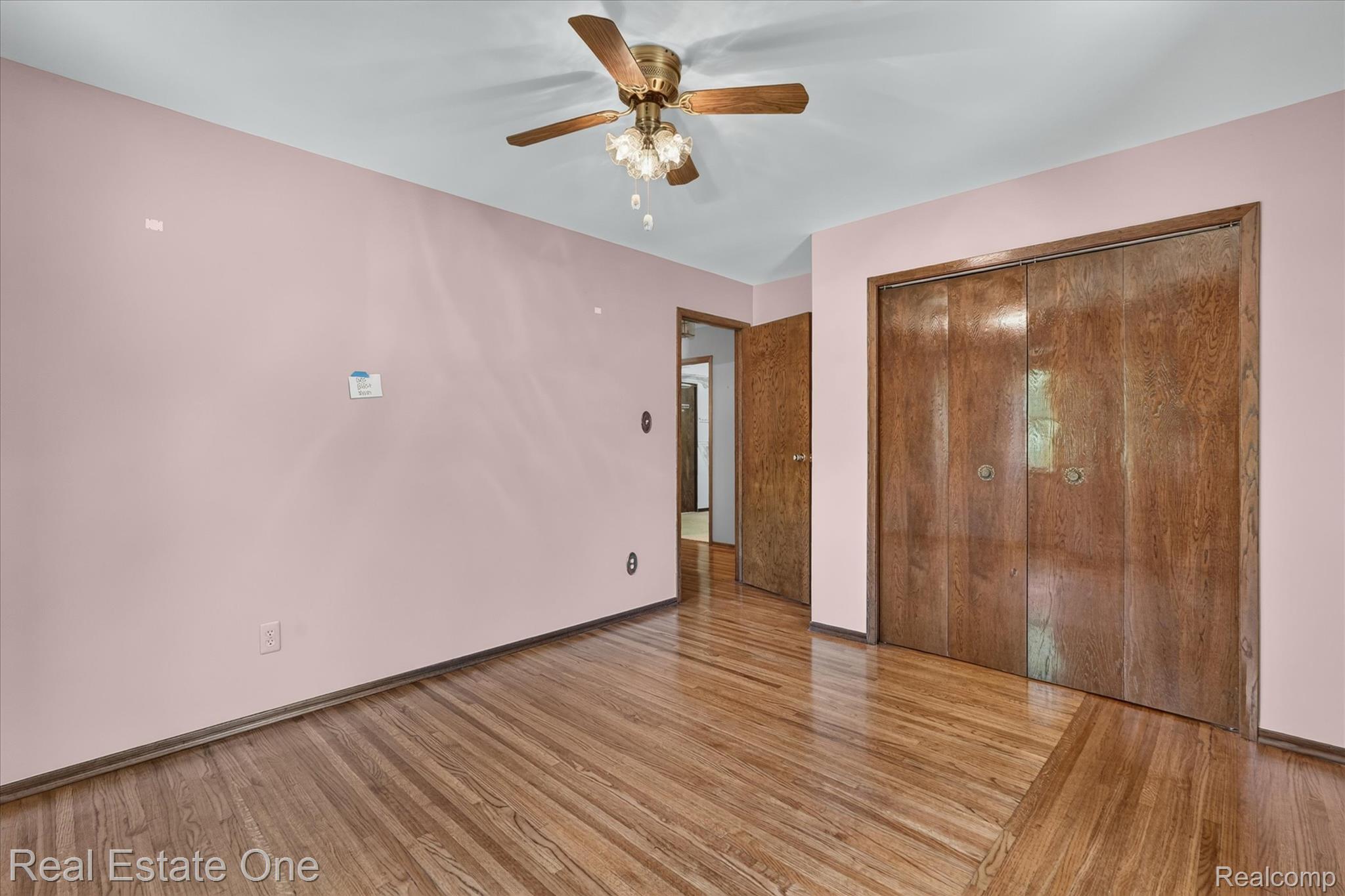6039 Fish Lake Road Holly, MI 48442 - Photo 29 of 64 Bedroom #4 Hardwood flooring and light-toned walls in a spacious room