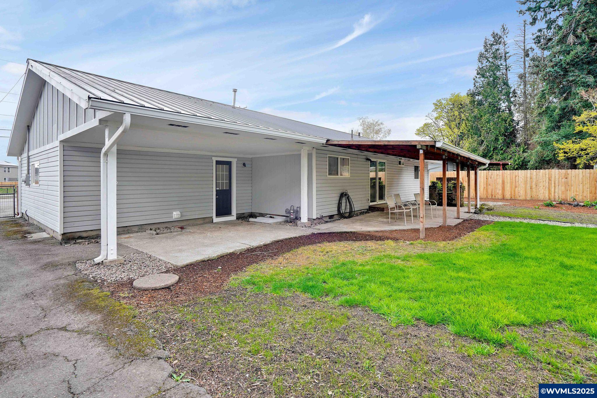 4843 Hazelgreen Road Northeast Salem, OR 97305 - Photo 44 of 48 a swimming pool with outdoor seating and yard