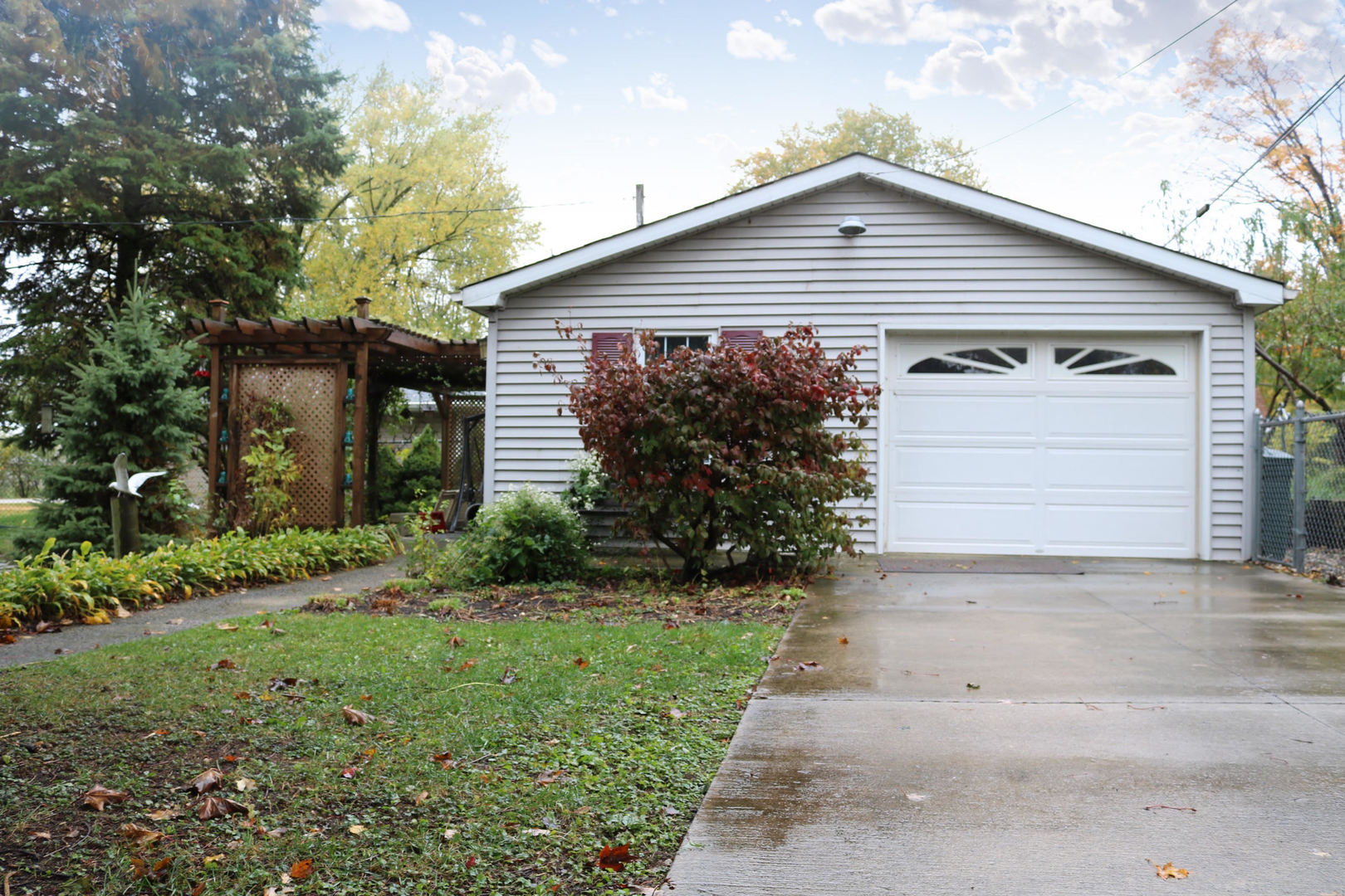 19240 Airport Road Romeoville, IL 60446 - Photo 2 of 14 a front view of a house with a garden and plants
