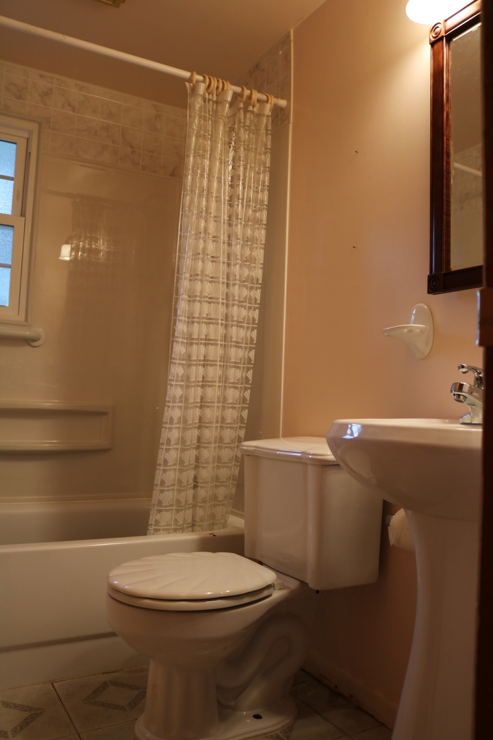 19240 Airport Road Romeoville, IL 60446 - Photo 11 of 14 a bathroom with a toilet and shower