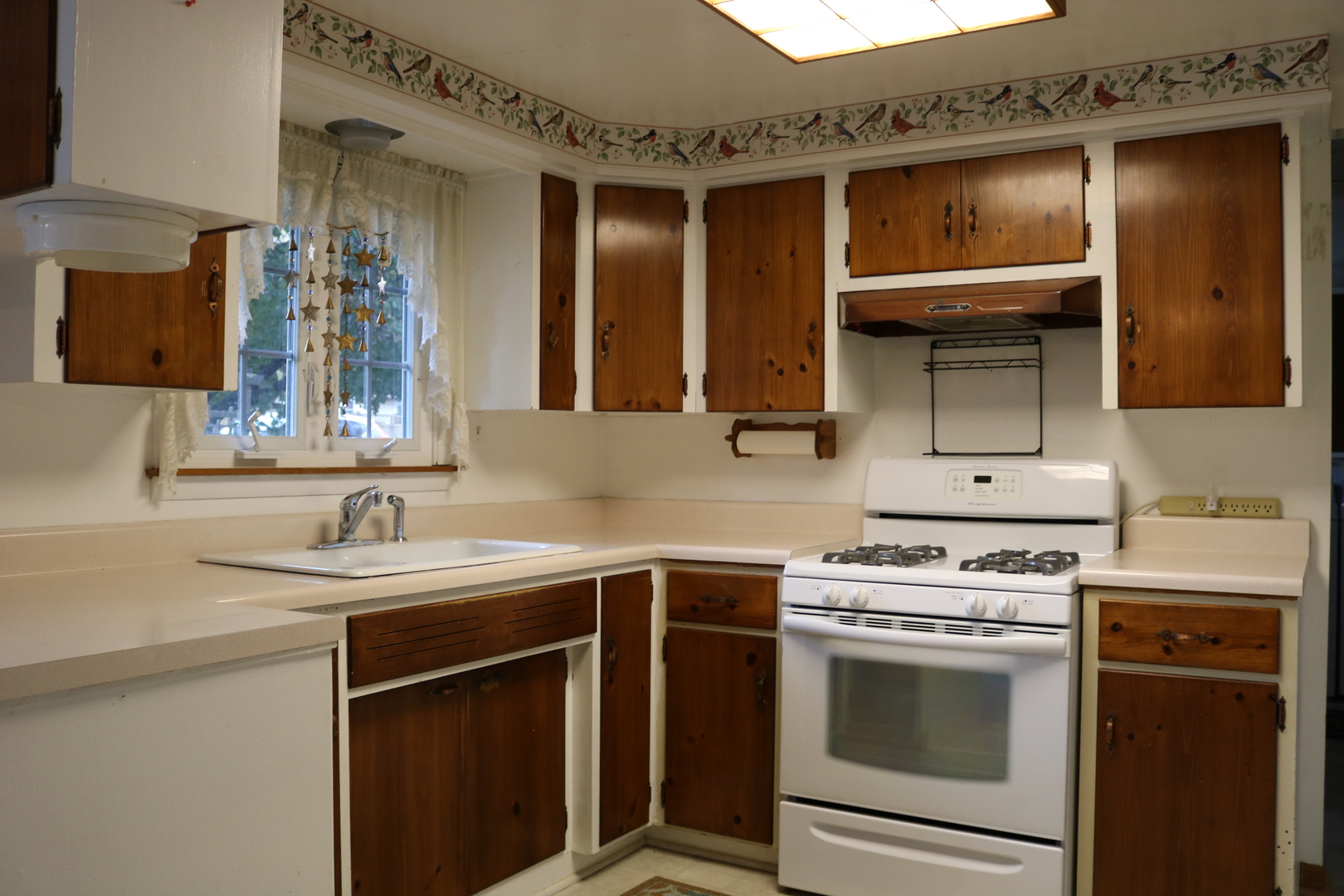 19240 Airport Road Romeoville, IL 60446 - Photo 4 of 14 a kitchen with a sink stove and cabinets