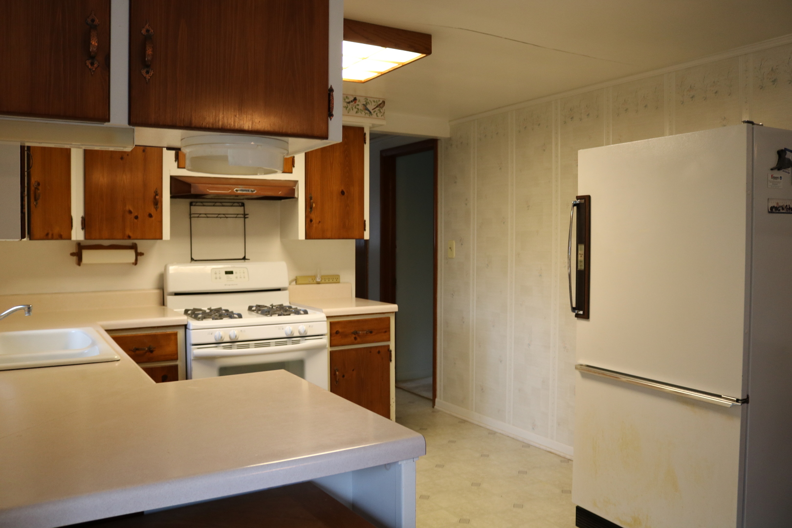 19240 Airport Road Romeoville, IL 60446 - Photo 5 of 14 a kitchen with stainless steel appliances a stove a refrigerator and cabinets