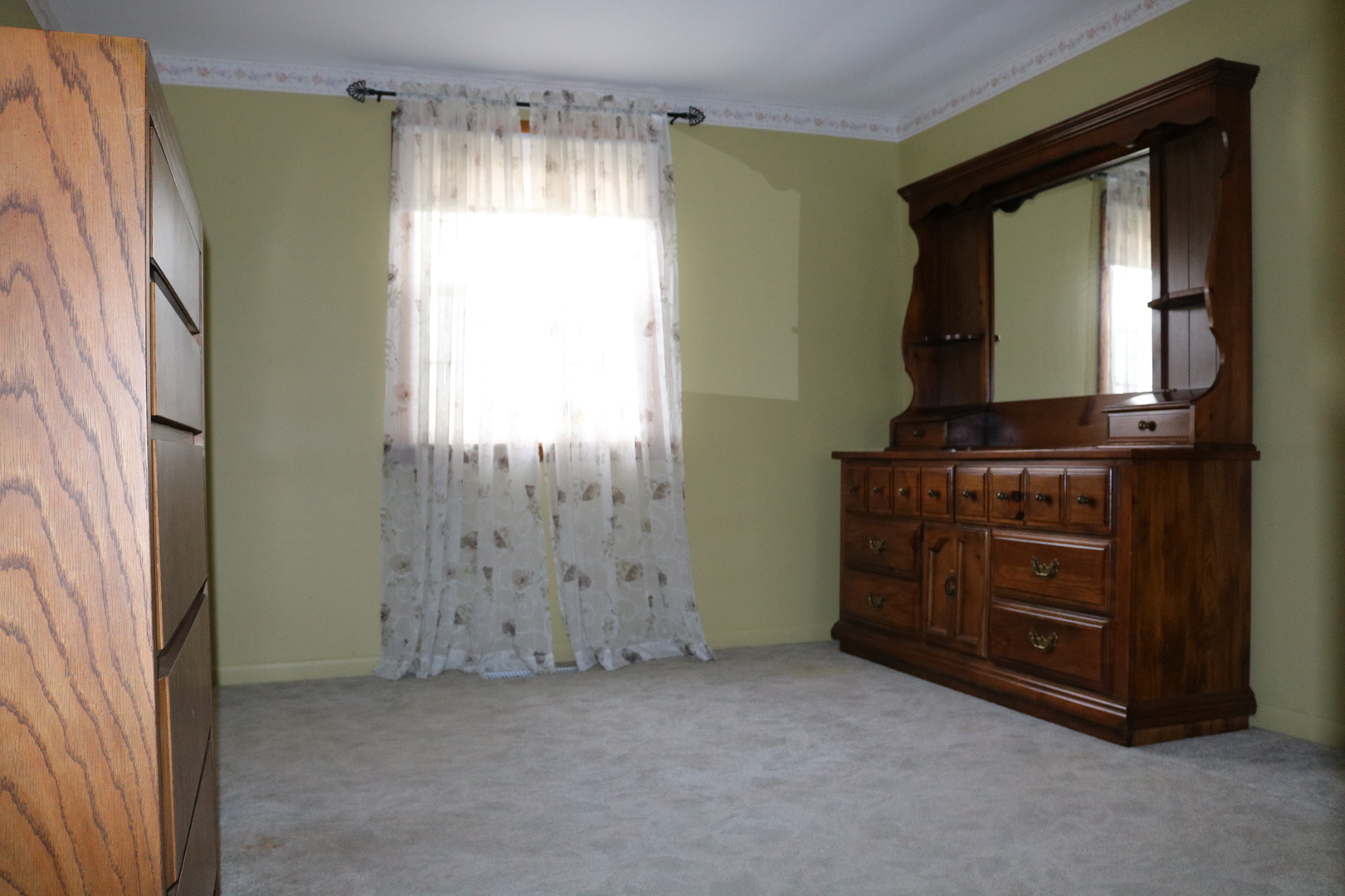 19240 Airport Road Romeoville, IL 60446 - Photo 10 of 14 a view of an empty room with a dresser and mirror