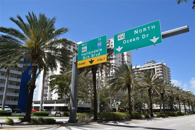 a bathroom with a shower a toilet and sink