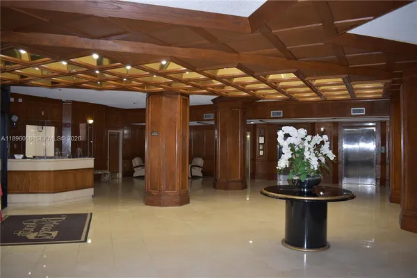 a living room with a flat screen tv and outdoor view