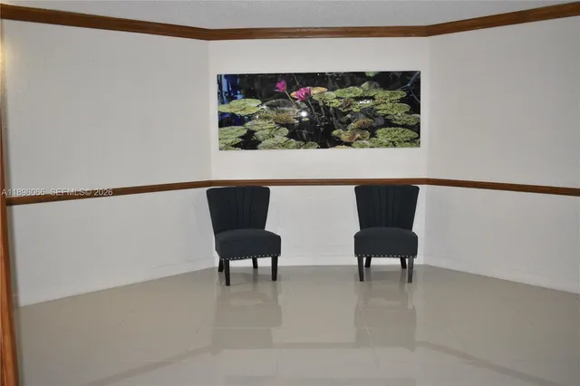 a living room with a flat screen tv and outdoor view