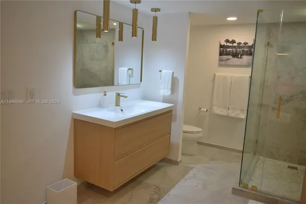 a living room with furniture chandelier and a chandelier