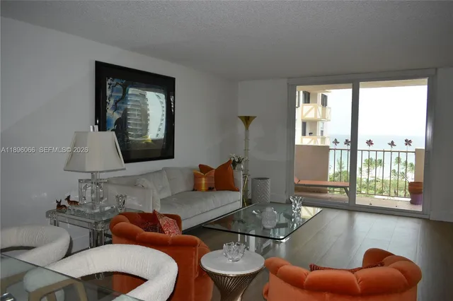 a large bed sitting in a bedroom and lamp