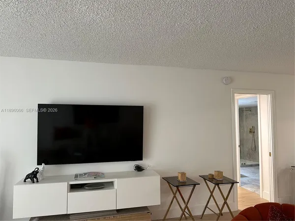 a white tub sitting next to a shower