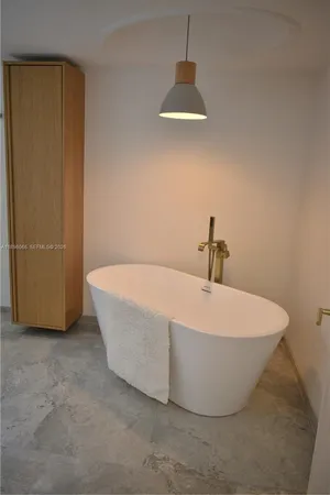 a kitchen with granite countertop a sink stainless steel appliances and cabinets