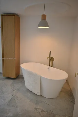 a kitchen with a sink stove and microwave