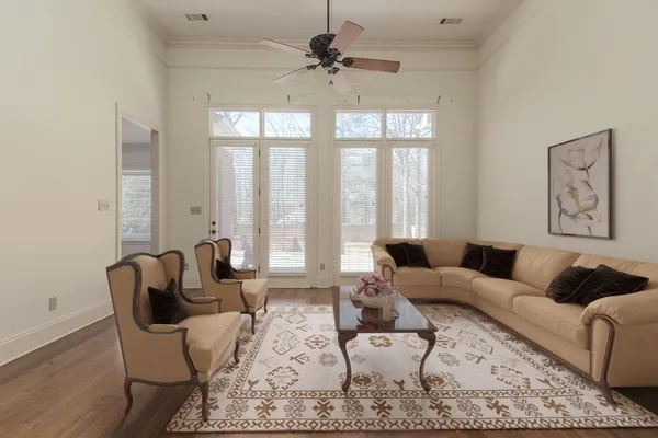 a living room with furniture and a large window