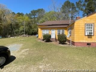 6563 Robinson Bridge Road, Unit A Morven, NC 28119 - Photo 2 of 9 a view of a house with a yard and potted plants