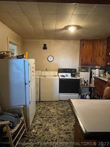 6563 Robinson Bridge Road, Unit A Morven, NC 28119 - Photo 7 of 9 a kitchen with a refrigerator and a stove