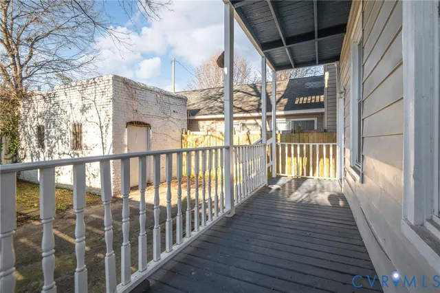 a view of a porch with wooden floor and outdoor space