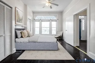 a bedroom with a large bed and a window