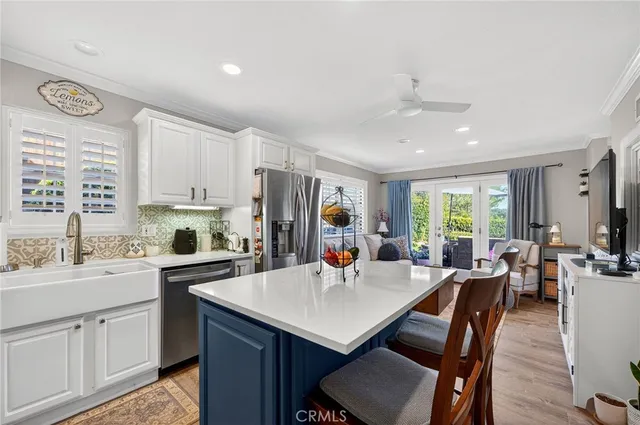a kitchen with a sink stove and microwave